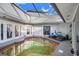 Enclosed pool area with patio furniture and covered structure at 34415 Kingfish St, Fruitland Park, FL 34731