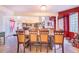 Bright dining room with a large wooden table and six chairs at 34415 Kingfish St, Fruitland Park, FL 34731