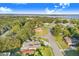 Aerial view of home near lake with lush green surroundings at 34415 Kingfish St, Fruitland Park, FL 34731