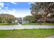 Landscaped front yard with a boat parked on the side at 34415 Kingfish St, Fruitland Park, FL 34731