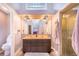 Large bathroom with double sinks, a walk-in shower, and updated fixtures at 34415 Kingfish St, Fruitland Park, FL 34731