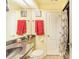 Bathroom with a single sink vanity, shower, and toilet at 34415 Kingfish St, Fruitland Park, FL 34731