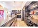 Modern kitchen with dark cabinetry and large island at 34415 Kingfish St, Fruitland Park, FL 34731
