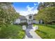 Beautiful house with a well-manicured lawn and walkway at 34415 Kingfish St, Fruitland Park, FL 34731