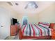 Main bedroom with a wooden sleigh bed and access to exterior at 34415 Kingfish St, Fruitland Park, FL 34731