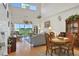 Open living room with large windows and hardwood floors at 35 Enclave Dr, Winter Haven, FL 33884