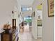 Bright and airy entryway with views into the living room at 35 Enclave Dr, Winter Haven, FL 33884