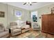 Relaxing sitting room with two recliners and built-in wooden cabinet at 35 Enclave Dr, Winter Haven, FL 33884