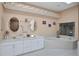 Large bathroom with a soaking tub and double sinks at 35 Enclave Dr, Winter Haven, FL 33884