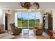 Relaxing living room with large windows overlooking a pasture at 35 Enclave Dr, Winter Haven, FL 33884
