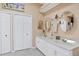 Bathroom with double vanity and large mirrors at 35 Enclave Dr, Winter Haven, FL 33884