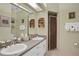 Double vanity bathroom with updated sinks and a shower at 35 Enclave Dr, Winter Haven, FL 33884