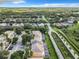 Community overview, showcasing homes, landscaping and a road at 1532 Still Dr, Clermont, FL 34714