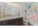 Charming bathroom with a unicorn-themed shower curtain at 955 Grandin St, Davenport, FL 33837