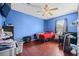 Blue bedroom with wood flooring and ceiling fan at 4003 Amron Dr, Orlando, FL 32822