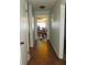 Hallway with tile floors leading to dining area at 2201 W Pilaklakaha Ave, Auburndale, FL 33823