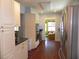 Modern kitchen with stainless steel appliances and wood floors at 2201 W Pilaklakaha Ave, Auburndale, FL 33823