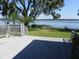 Spacious deck overlooking a tranquil lakefront at 2201 W Pilaklakaha Ave, Auburndale, FL 33823