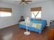 Spacious bedroom with wood flooring and ceiling fan at 2201 W Pilaklakaha Ave, Auburndale, FL 33823