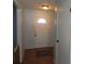 Simple entryway with tile floors and interior door at 2201 W Pilaklakaha Ave, Auburndale, FL 33823