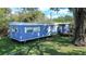 Mobile home with covered porch, and a spacious yard at 1915 Josephine St, Lakeland, FL 33815