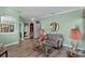 Bright living room featuring a comfy sofa and large windows at 3820 Traditions N Blvd, Winter Haven, FL 33884