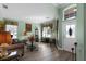 Spacious living room with green walls and wood floors at 3820 Traditions N Blvd, Winter Haven, FL 33884