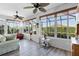 Bright sunroom with hardwood floors, ceiling fans, and ample natural light at 3820 Traditions N Blvd, Winter Haven, FL 33884