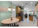 Kitchen with breakfast nook and decorative lighting fixture at 3820 Traditions N Blvd, Winter Haven, FL 33884