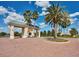 Gated community entrance with palm trees and brick pavers at 3820 Traditions N Blvd, Winter Haven, FL 33884