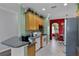 Well-equipped kitchen, featuring wood cabinets and a breakfast bar at 3820 Traditions N Blvd, Winter Haven, FL 33884