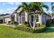 House exterior with lush landscaping and palm trees at 3820 Traditions N Blvd, Winter Haven, FL 33884