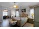 Spacious main bedroom with a large four-poster bed and ensuite bathroom at 3820 Traditions N Blvd, Winter Haven, FL 33884
