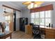 Home office with built-in desk, safe, and window with plantation shutters at 3820 Traditions N Blvd, Winter Haven, FL 33884