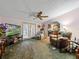 Bright living room with access to the kitchen and patio doors at 126 Bermuda Ct, Winter Haven, FL 33880