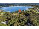 High-level aerial view of home on a peaceful lake at 126 Bermuda Ct, Winter Haven, FL 33880