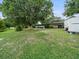 Spacious backyard with a swing set and storage shed at 126 Bermuda Ct, Winter Haven, FL 33880