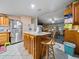 Kitchen boasts an island with seating and wood cabinets at 126 Bermuda Ct, Winter Haven, FL 33880