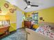 Cozy bedroom with a double bed, dresser, and window overlooking the backyard at 126 Bermuda Ct, Winter Haven, FL 33880