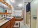 Bathroom features a double vanity, a soaking tub, and a shower at 126 Bermuda Ct, Winter Haven, FL 33880