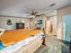 Main bedroom with ensuite bathroom access and a ceiling fan at 126 Bermuda Ct, Winter Haven, FL 33880