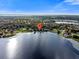 An expansive aerial view showcasing the property's idyllic lakefront location at 126 Bermuda Ct, Winter Haven, FL 33880