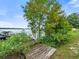 Wooden dock on the lake with a boat lift and tranquil surroundings at 126 Bermuda Ct, Winter Haven, FL 33880