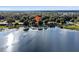 Wide aerial view of property near a large lake at 126 Bermuda Ct, Winter Haven, FL 33880