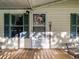 Front door entrance with teal shutters and wreath at 126 Bermuda Ct, Winter Haven, FL 33880