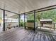 Wooden deck with a grill and lattice fencing, offering a relaxing outdoor space at 126 Bermuda Ct, Winter Haven, FL 33880
