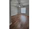 Bedroom with wood-look floors and ceiling fan at 210 Lake Thomas Dr, Winter Haven, FL 33880