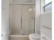 Bathroom featuring a tiled shower with glass enclosure at 5233 Oakbourne Ave, Davenport, FL 33837