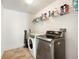 Laundry room with washer, dryer, and shelving at 4189 Cannes Ave, Lake Wales, FL 33859