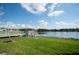 Scenic lake view with a dock and lush greenery at 4189 Cannes Ave, Lake Wales, FL 33859